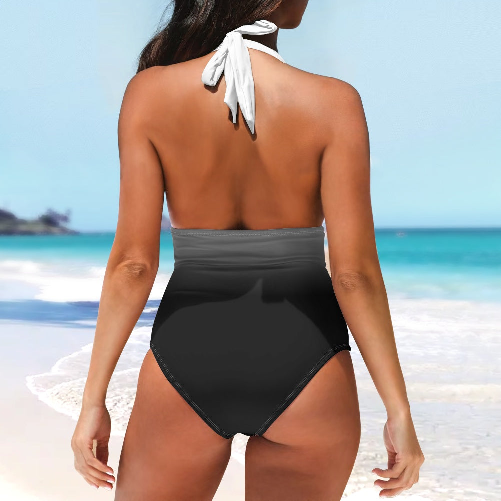 Woman wearing a black and gray swimsuit on a beach
