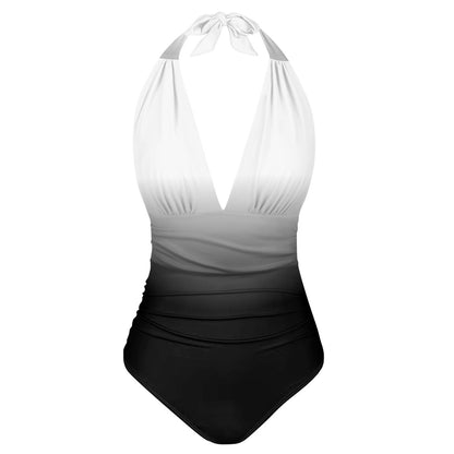 One-piece swimsuit with white top and black bottom on a white background