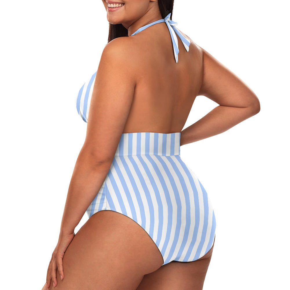 Woman wearing a blue and white striped swimsuit on a white background