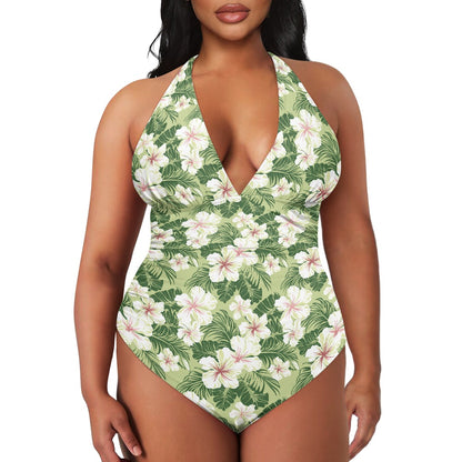 Tropical floral one-piece swimsuit on a model against a white background