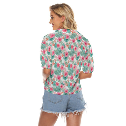 Woman wearing a floral shirt and denim shorts on a white background
