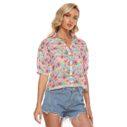 Woman wearing a colorful floral blouse and denim shorts on a white background