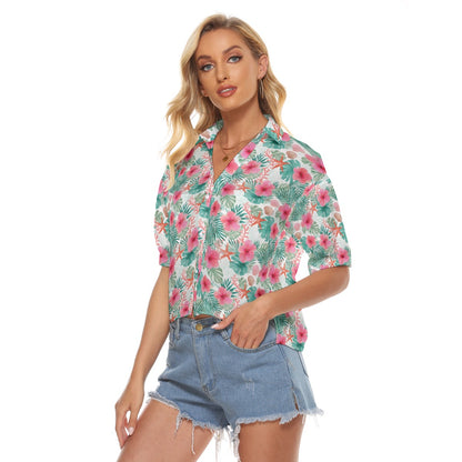 Woman wearing a floral shirt and denim shorts on a white background