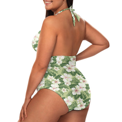Woman wearing a green and white floral swimsuit on a white background