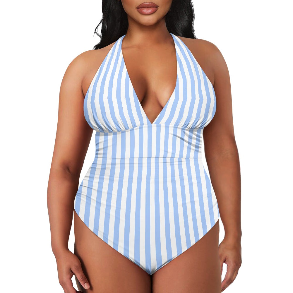 Woman wearing a blue and white striped swimsuit on a white background