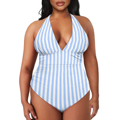 Woman wearing a blue and white striped swimsuit on a white background