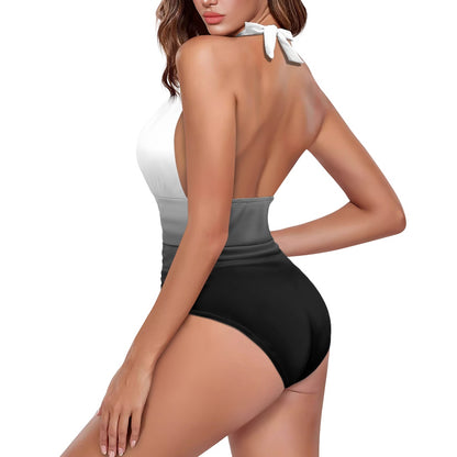 Woman wearing a black and white swimsuit on a white background